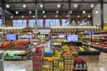 Filamento lights used for high ceiling grocery store Aisle One located in Passaic, New Jersey, increasing LED output, reducing glare, and increasing efficiency.